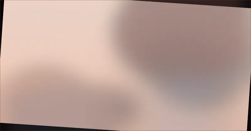 Person closing a laptop at a tidy desk beside a handwritten checklist in early evening light